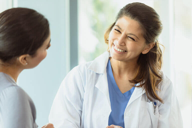primary care doctor smiling at patient